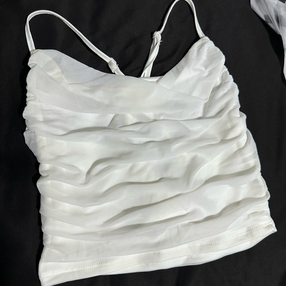 Sheer ruffled white top with criss cross straps